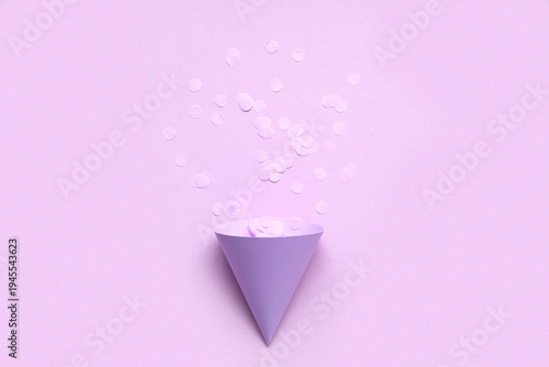 Party hat and confetti on l...