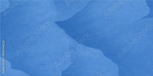 An abstract grunge texture of cold blue paint on an old wall captures the frozen essence of winter frost and a cloudy sky on a white paper surface