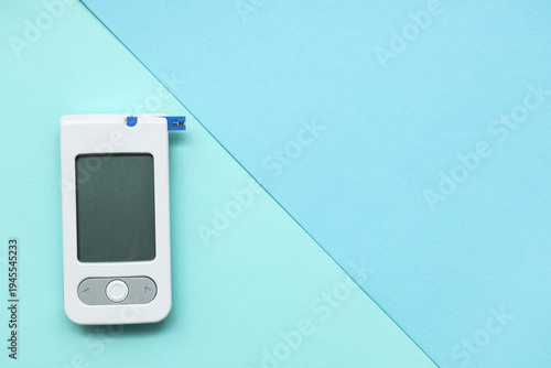 White digital glucometer on...