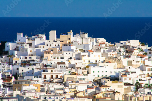 An Andalusian white town with the blue Mediterranean sea behind