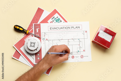 Man with smoke detector and...