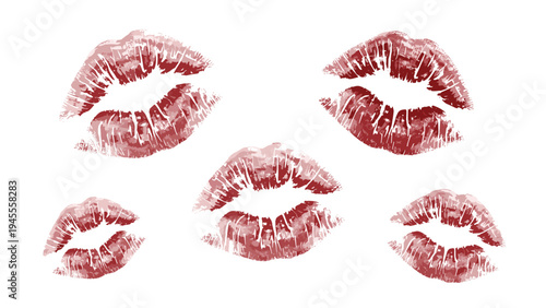 Collection of red lipstick kiss marks scattered across a white background representing romance, love, and feminine beauty.