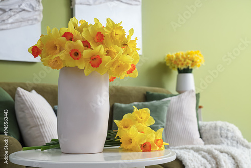 Vase with yellow daffodils ...