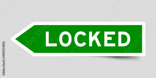 Green color arrow shape sticker label with word locked on gray background
