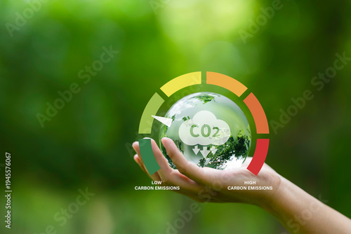 Wallpaper Mural Globe and Carbon emission icon on hand for Reduce levels of greenhouse gas, decarbonize industry, energy and transportation. Lower CO2 emission to limit for Carbon neutral and net zero. Torontodigital.ca