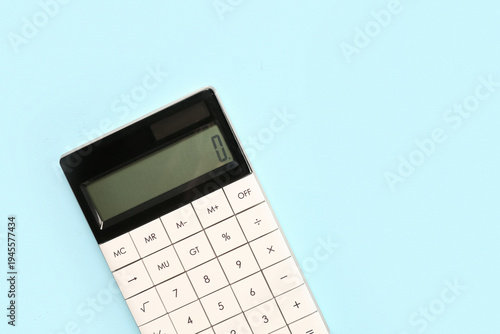 Modern calculator on blue b...