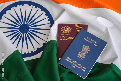 Fotografía View of Overseas Citizen of India Card with Portuguese passport on Indian flag background