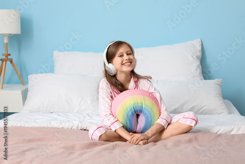 Little girl with headphones...