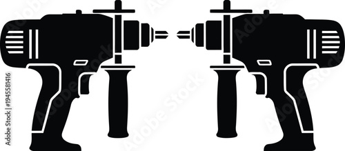 Two black cordless drills facing each other on a white background