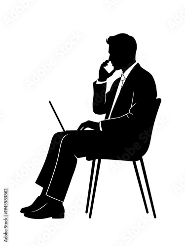 Businessman in suit sitting on chair and working on laptop silhouette