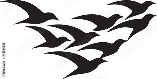 A flock of black birds flying in a cohesive v shaped formation