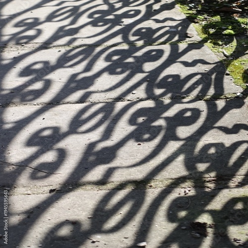 Abstract decorative shadow pattern on concrete pavement