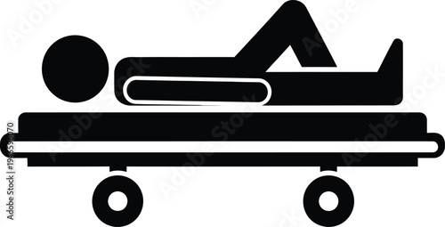 A person lying on a hospital gurney or stretcher with their legs elevated