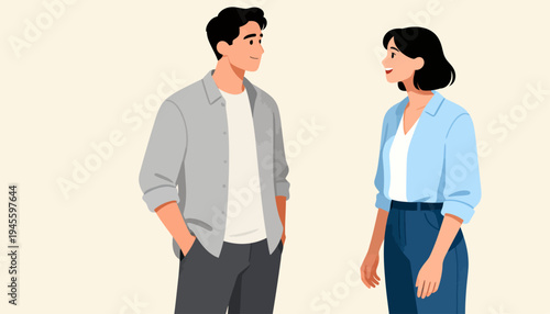 Two people stand facing each other, engaged in conversation. Their expressions show calm, attentive interaction. Neutral tones suggest a professional or casual setting. Ideal for business meetings