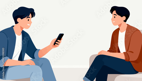 Two men sit, one showing phone to other. Smiling man shares content, attentive listener. Casual attire, relaxed posture, friendly vibe. Perfect for social, tech, or communication themes