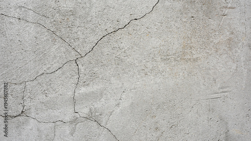 old plaster on the wall, cement, adhesive for screed. the old clay wall is crumbling. surface wall for vintage background. Wall texture, cracked plaster, grey cement floor, needs repair, restoration