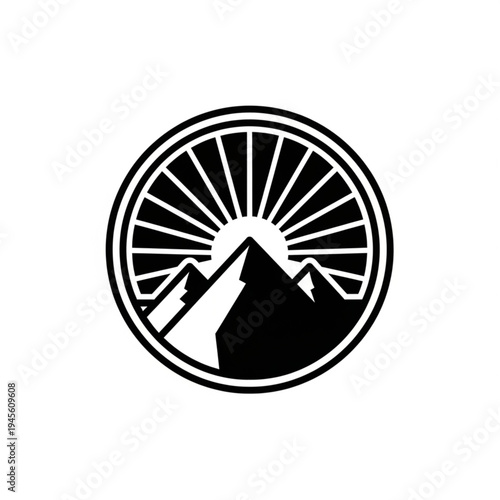 Stylized mountain range with sunburst rising behind peaks, enclosed in a circular emblem with radiating lines.