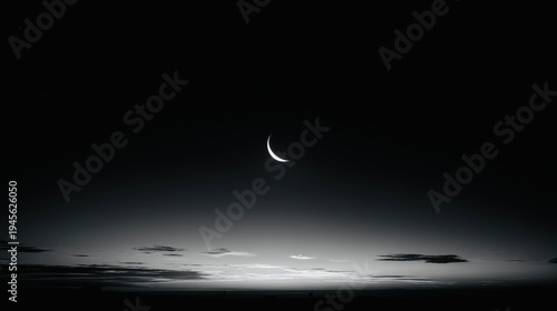 Tableau sur toile Crescent moon over calm horizon in minimal night sky