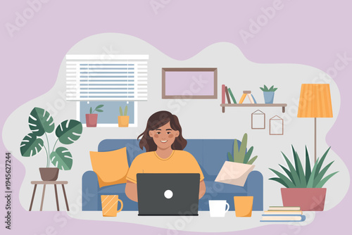 Woman working on laptop at home relaxing on a comfortable blue sofa