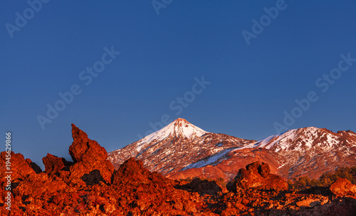 Mount Teide Volcano at Sunset Above Red Lava Landscape in Teide National Park, Tenerife