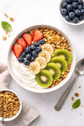 Healthy Breakfast Bowl with Granola Yogurt and Fresh Fruits Top View