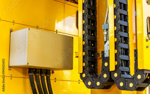  Induastrial machine pattern with yellow tolls and steel cable elements of industry production line on a factory. Manufacturing concept background for workplace desing .