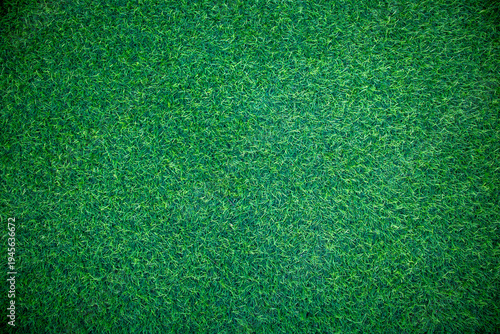 Fotografie Top view of vibrant green artificial turf texture, synthetic grass background for sports or lawn