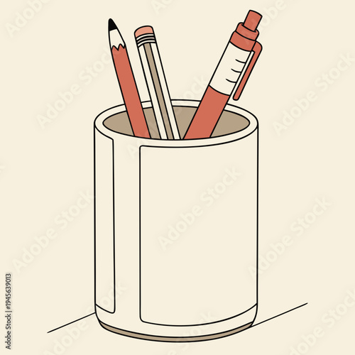 Office supplies in a pencil holder on a desk