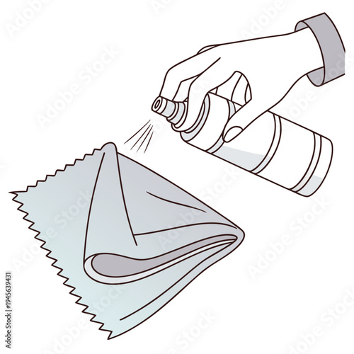 Hand spraying cleaning solution on cloth