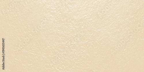 Beige textured paper background with subtle grain, minimalist cream stucco wall surface for luxury brand backdrop
