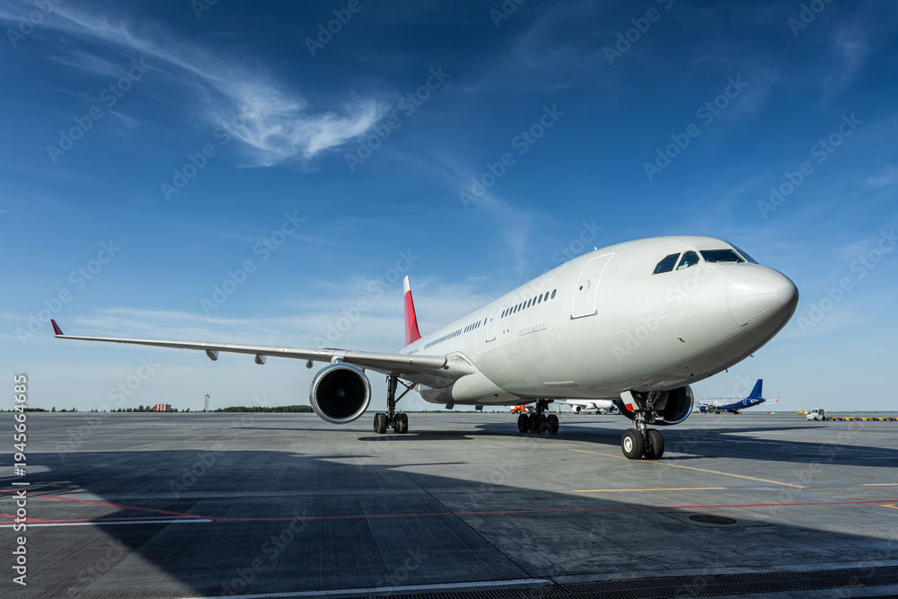 Fototapeta premium Big wide body passenger plane at the airport