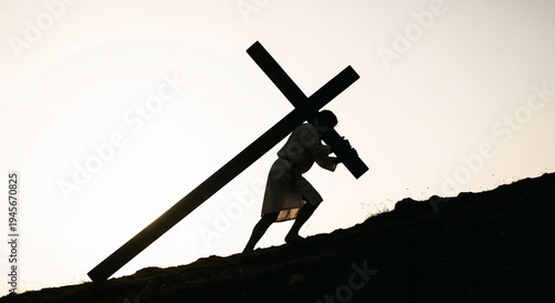 Silhouette of Jesus carrying cross on hill at sunset, Christian faith concept