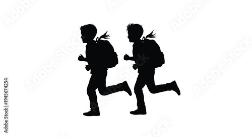 Two children with backpacks running playfully a dark silhouette