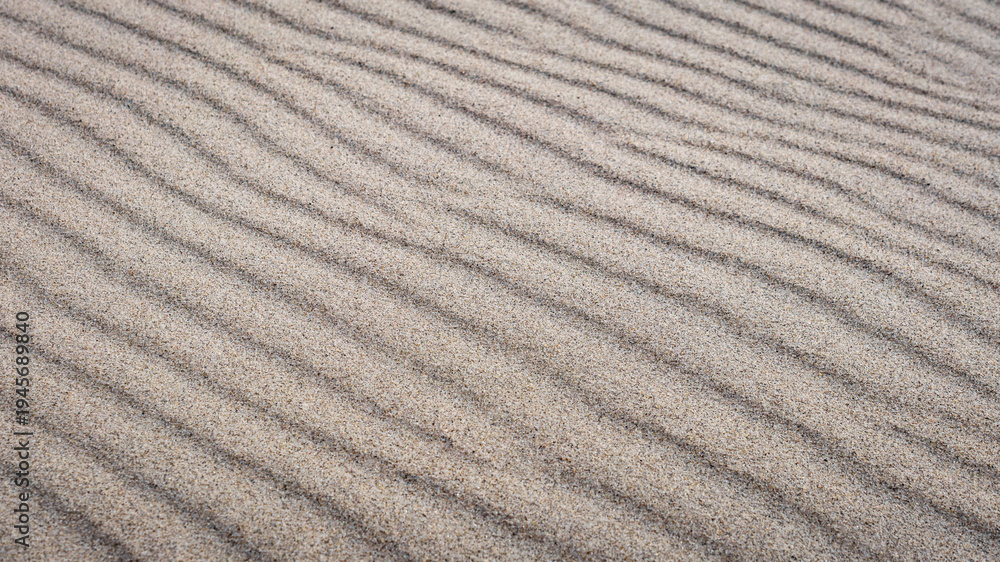 Fototapeta premium A wave-like untouched sand structure formed by wind