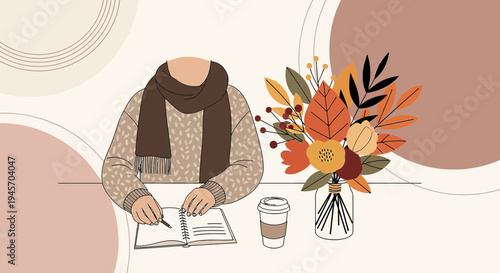 Cozy Autumn Scene: Person Writing, Coffee, and Floral Arrangement