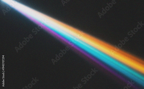 Prismatic Light Ray Beam Across Dark Textured Surface with Vibrant Colors