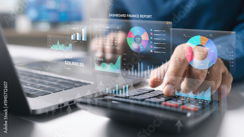 Businessman use laptop and calculator to finance management on financial analytics dashboard to accounting data analysis, growth chart report, portfolio performance and investment metrics.