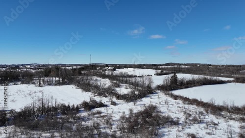 An aerial drone view of houses in winter