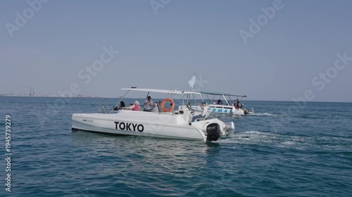 High angle view of a sturgeon swimming in a circular tank at an industrial aquaculture farm.