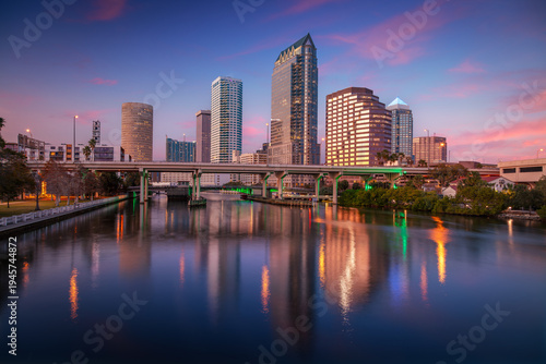 Tampa, Florida, USA. Cityscape image of Tampa, Florida with reflection of the city skyline in the water at beautiful sunset.
