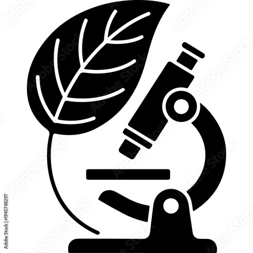 A microscope with a leaf on it