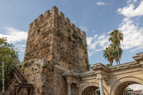 An ancient fortress tower. The famous gate, built in honor of the ancient Roman emperor. The tower near the Arc de Triomphe in the Kaleichi district. Hadrian's Gate in Antalya.