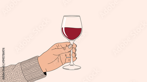 Close up view of a hand holding a single glass of red wine for a toast or celebration against a warm neutral background at a party.