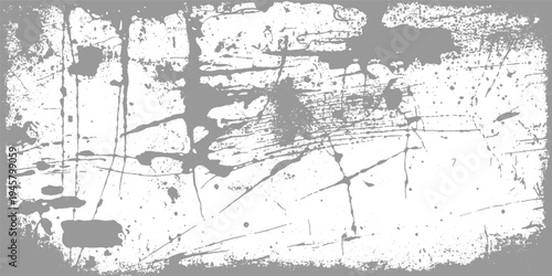 Gray paint splatters and scratches on white textured background