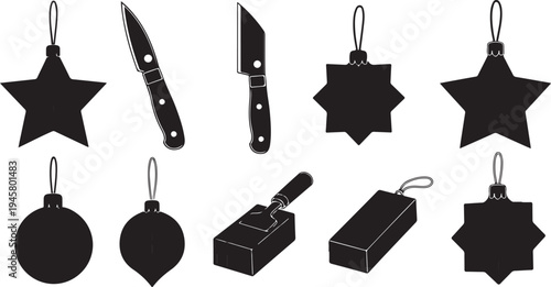 Black Christmas ornaments and kitchen tools on white background