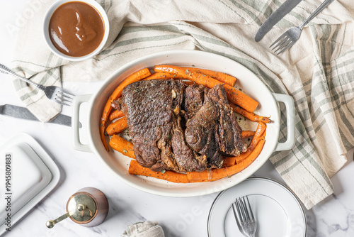 Fotografie Beef pot roast with roasted carrots. American food dinner