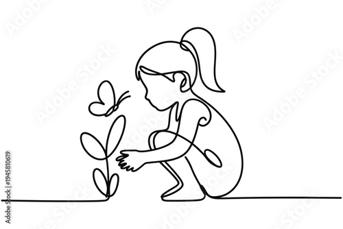 A young girl kneels to observe a butterfly near a plant