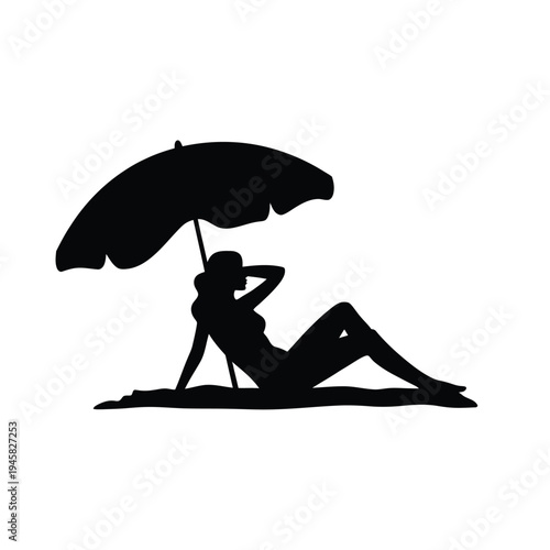 Silhouette of a woman relaxing under an umbrella on the beach