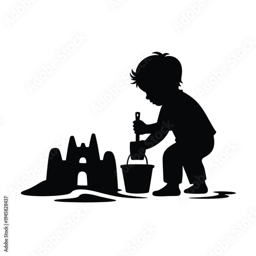 Silhouette of a child building sandcastles on a beach