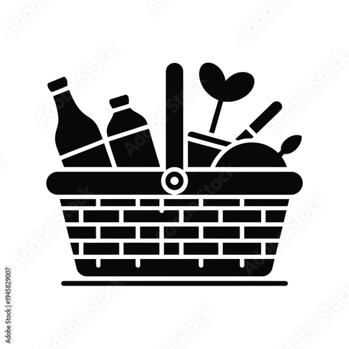 A black silhouette illustration of a picnic basket filled with food